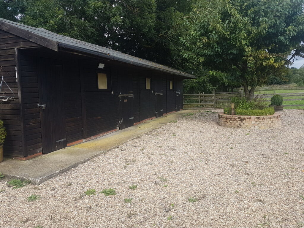 Gravel area outside stables.